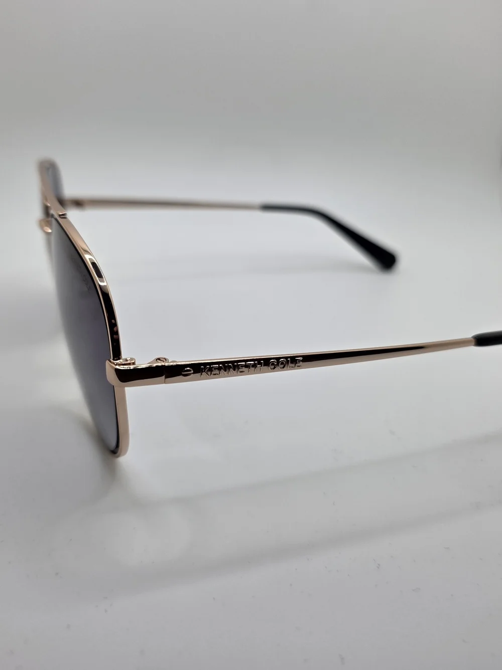 Kenneth Cole Rose Gold Aviator Sunglasses with Dark Gradient Lenses